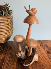 Wooden Snail on Three Mushrooms