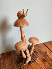 Wooden Snail on Three Mushrooms