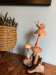 Wooden Snail on Three Mushrooms