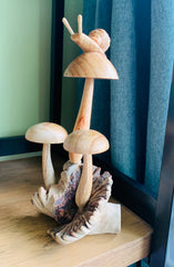 Wooden Snail on Three Mushrooms