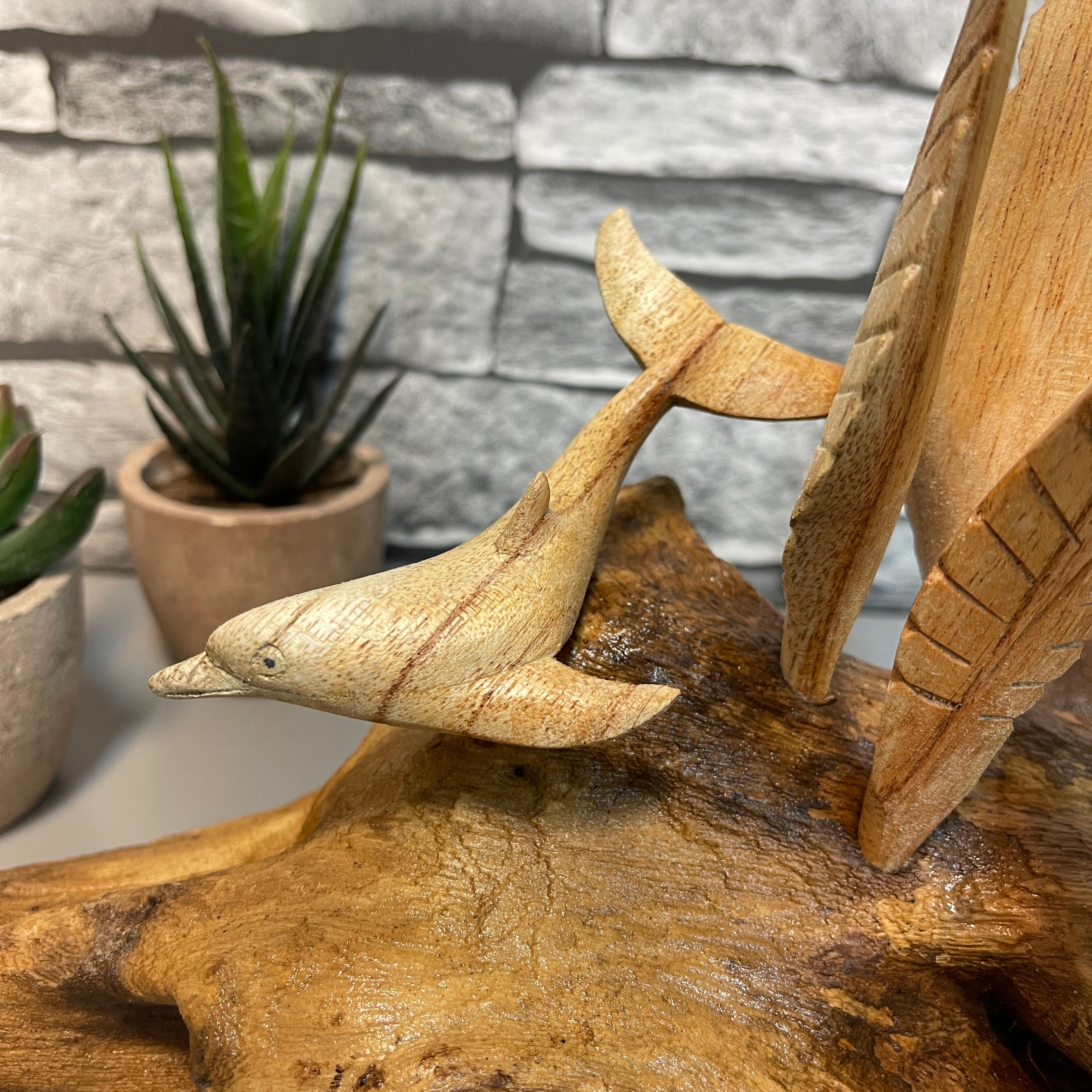 Wood Dolphins On Log